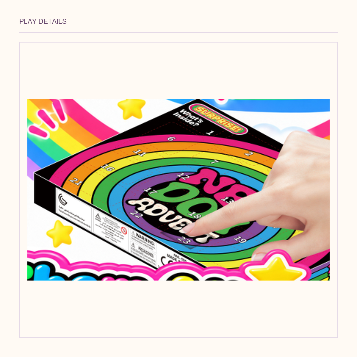Original angled rainbow countdown-box view with a hand opening one of its numbered doors